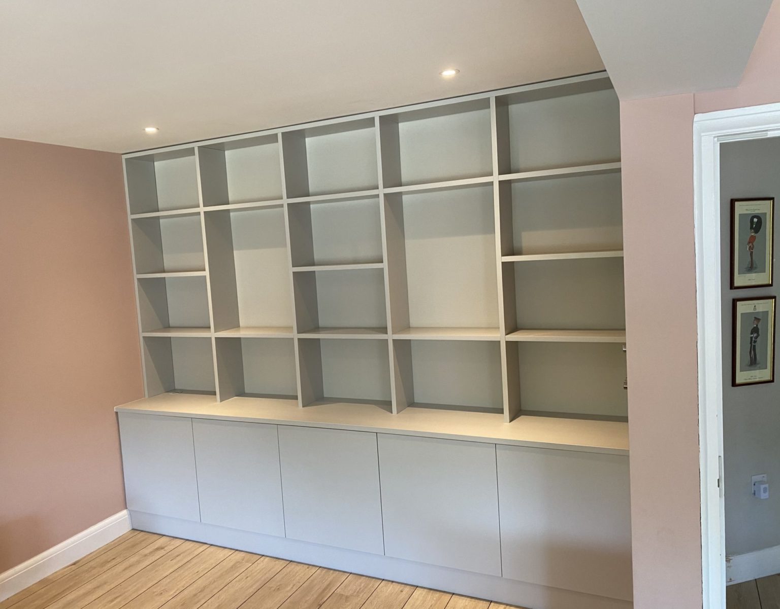 Bespoke fitted bookcase storage spray finished in farrow and ball conforth white Surrey